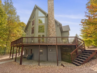 Experience year-round comfort and elegance in this meticulously on Crystal Mountain Golf Course in Michigan - for sale on GolfHomes.com, golf home, golf lot