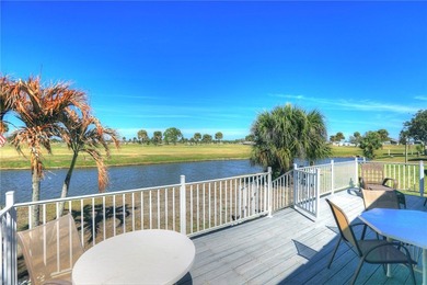 One of the best views in Barefoot Bay, overlooking both the golf on Barefoot Bay Golf Course in Florida - for sale on GolfHomes.com, golf home, golf lot