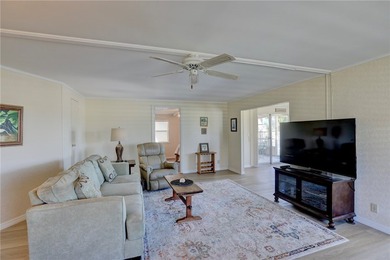 One of the best views in Barefoot Bay, overlooking both the golf on Barefoot Bay Golf Course in Florida - for sale on GolfHomes.com, golf home, golf lot