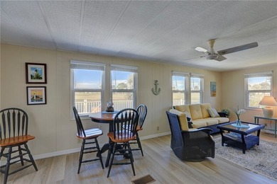 One of the best views in Barefoot Bay, overlooking both the golf on Barefoot Bay Golf Course in Florida - for sale on GolfHomes.com, golf home, golf lot