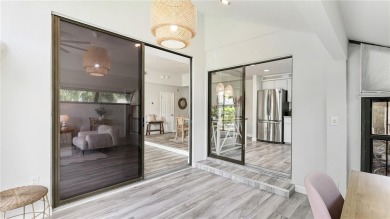 Step into a space that feels like you've left Sarasota behind on The Meadows Golf and Country Club in Florida - for sale on GolfHomes.com, golf home, golf lot