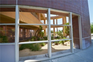 The Desert Sun Building - a stunning piece of Palm Springs on Escena Golf Club in California - for sale on GolfHomes.com, golf home, golf lot