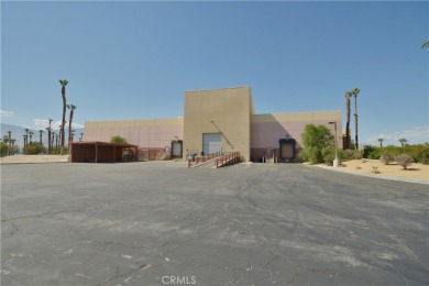 The Desert Sun Building - a stunning piece of Palm Springs on Escena Golf Club in California - for sale on GolfHomes.com, golf home, golf lot