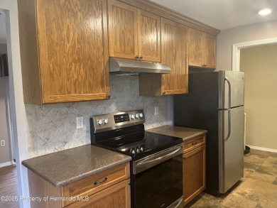 Looking for an UPDATED, move-in ready condo? Look no further on Heather Golf and Country Club in Florida - for sale on GolfHomes.com, golf home, golf lot