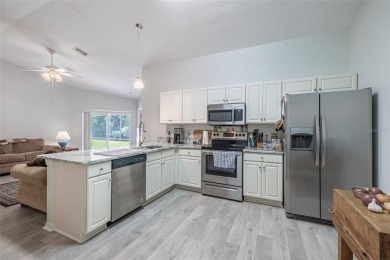UPDATED, MOVE-IN-READY, MAINTENANCE-FREE VILLA ON A PRIVATE on Tampa Bay Golf and Country Club in Florida - for sale on GolfHomes.com, golf home, golf lot