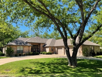 Classic elegance with a tastefully updated finish! This home is on Pecan Plantation Country Club in Texas - for sale on GolfHomes.com, golf home, golf lot