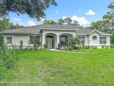 Fall in love with this picturesque Golf Course View heated pool on Citrus Hills Golf Club in Florida - for sale on GolfHomes.com, golf home, golf lot