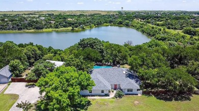 A one-of-a-kind, light-filled home with gorgeous grounds that on Squaw Creek Golf Club in Texas - for sale on GolfHomes.com, golf home, golf lot
