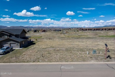 Discover your dream home site with this exceptional flat lot on Grand Elk Ranch and Club in Colorado - for sale on GolfHomes.com, golf home, golf lot