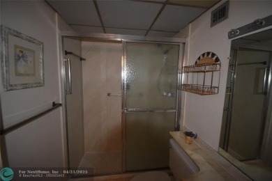 Discover convenience, and scenic beauty in this lovely 2-bedroom on Inverrary Country Club in Florida - for sale on GolfHomes.com, golf home, golf lot