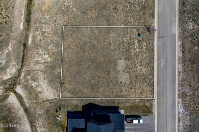 Discover your dream home site with this exceptional flat lot on Grand Elk Ranch and Club in Colorado - for sale on GolfHomes.com, golf home, golf lot