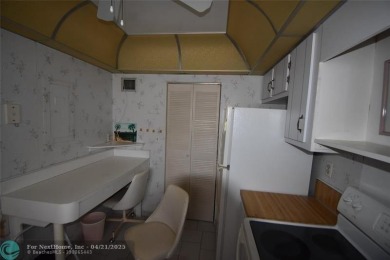 Discover convenience, and scenic beauty in this lovely 2-bedroom on Inverrary Country Club in Florida - for sale on GolfHomes.com, golf home, golf lot