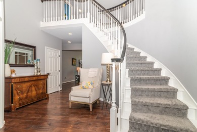 New wood floors throughout the main level welcome you to this on Travis Pointe Country Club in Michigan - for sale on GolfHomes.com, golf home, golf lot