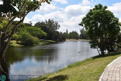 Discover convenience, and scenic beauty in this lovely 2-bedroom on Inverrary Country Club in Florida - for sale on GolfHomes.com, golf home, golf lot