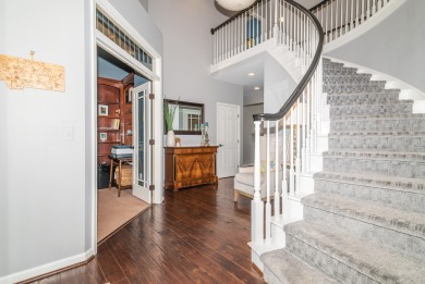 New wood floors throughout the main level welcome you to this on Travis Pointe Country Club in Michigan - for sale on GolfHomes.com, golf home, golf lot