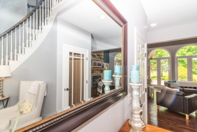 New wood floors throughout the main level welcome you to this on Travis Pointe Country Club in Michigan - for sale on GolfHomes.com, golf home, golf lot