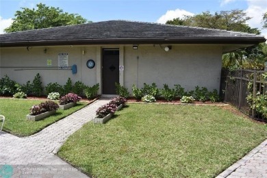Discover convenience, and scenic beauty in this lovely 2-bedroom on Inverrary Country Club in Florida - for sale on GolfHomes.com, golf home, golf lot