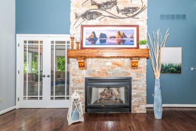 New wood floors throughout the main level welcome you to this on Travis Pointe Country Club in Michigan - for sale on GolfHomes.com, golf home, golf lot