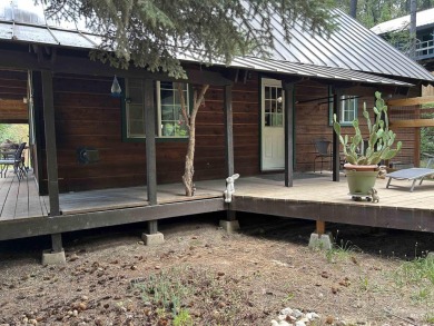 Cedar Cabin in the woods walking distance to Terrace Lakes Golf on Terrace Lakes Golf Resort in Idaho - for sale on GolfHomes.com, golf home, golf lot