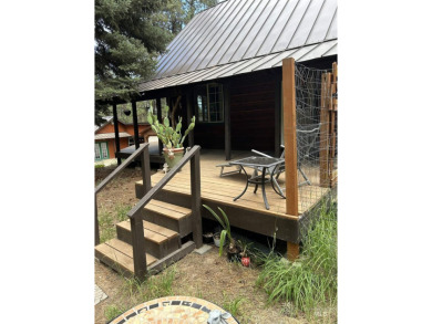 Cedar Cabin in the woods walking distance to Terrace Lakes Golf on Terrace Lakes Golf Resort in Idaho - for sale on GolfHomes.com, golf home, golf lot