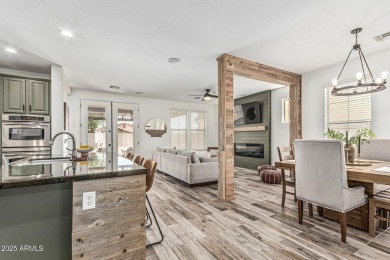 A beautifully crafted 4-bedroom, 2.5-bath Farmhouse-style home on Verrado Golf Club  in Arizona - for sale on GolfHomes.com, golf home, golf lot