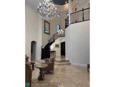 Magnificent custom home in PGCC. This mini mansion offers 6 on Parkland Golf Club in Florida - for sale on GolfHomes.com, golf home, golf lot