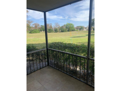 Nestled in a serene enclave a spacious ground floor1/1  living on Inverrary Country Club in Florida - for sale on GolfHomes.com, golf home, golf lot