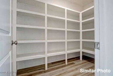 The Otter by American Homesmith offers easy, coastal living in on Lennon Hills Golf Course in North Carolina - for sale on GolfHomes.com, golf home, golf lot