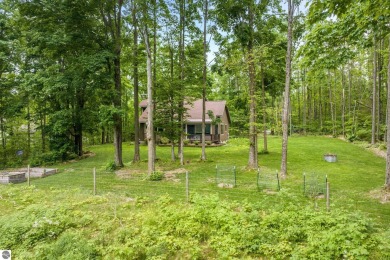 Enjoy a peaceful, wooded retreat. This charming property offers on Black Forest At Wilderness Valley in Michigan - for sale on GolfHomes.com, golf home, golf lot