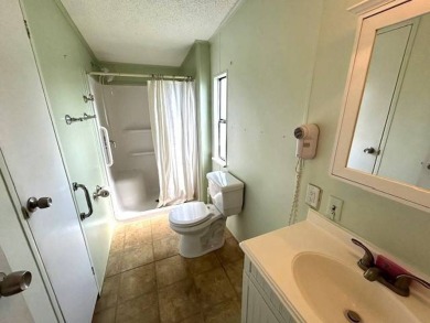 Don't miss this opportunity to own a charming 1988 2-bedroom on Crystal Lake Club in Florida - for sale on GolfHomes.com, golf home, golf lot