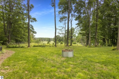 Enjoy a peaceful, wooded retreat. This charming property offers on Black Forest At Wilderness Valley in Michigan - for sale on GolfHomes.com, golf home, golf lot