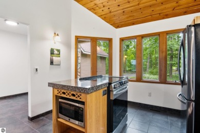 Enjoy a peaceful, wooded retreat. This charming property offers on Black Forest At Wilderness Valley in Michigan - for sale on GolfHomes.com, golf home, golf lot