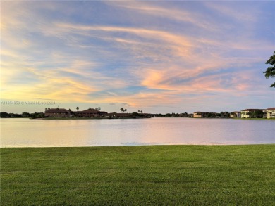 WOW! ** CENTER LAKE CORNER UNIT **( 1,533 sq ft,  shows larger on Flamingo Lakes Country Club in Florida - for sale on GolfHomes.com, golf home, golf lot