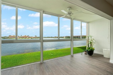 WOW! ** CENTER LAKE CORNER UNIT **( 1,533 sq ft,  shows larger on Flamingo Lakes Country Club in Florida - for sale on GolfHomes.com, golf home, golf lot