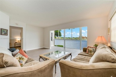 WOW! ** CENTER LAKE CORNER UNIT **( 1,533 sq ft,  shows larger on Flamingo Lakes Country Club in Florida - for sale on GolfHomes.com, golf home, golf lot