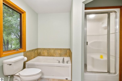 Enjoy a peaceful, wooded retreat. This charming property offers on Black Forest At Wilderness Valley in Michigan - for sale on GolfHomes.com, golf home, golf lot