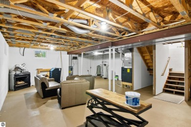 Enjoy a peaceful, wooded retreat. This charming property offers on Black Forest At Wilderness Valley in Michigan - for sale on GolfHomes.com, golf home, golf lot