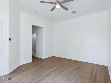Experience the perfect blend of modern comfort and resort-style on Laughlin Ranch Golf Club in Arizona - for sale on GolfHomes.com, golf home, golf lot