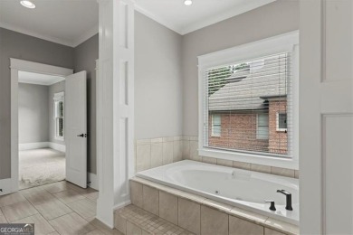 This magnificent home seamlessly blends modern design with on Hamilton Mill Golf Club in Georgia - for sale on GolfHomes.com, golf home, golf lot