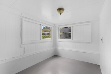 Welcome home to 217 Haihai Street-an inviting three-bedroom, two on Hilo Municipal Golf Course in Hawaii - for sale on GolfHomes.com, golf home, golf lot