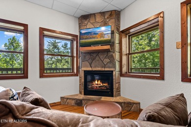 This beautifully designed 3-bedroom, 2.5-bath cabin, featuring a on Bent Creek Golf Course in Tennessee - for sale on GolfHomes.com, golf home, golf lot