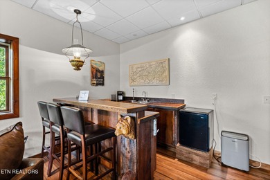 This beautifully designed 3-bedroom, 2.5-bath cabin, featuring a on Bent Creek Golf Course in Tennessee - for sale on GolfHomes.com, golf home, golf lot