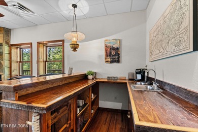 This beautifully designed 3-bedroom, 2.5-bath cabin, featuring a on Bent Creek Golf Course in Tennessee - for sale on GolfHomes.com, golf home, golf lot