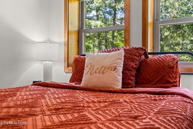 This beautifully designed 3-bedroom, 2.5-bath cabin, featuring a on Bent Creek Golf Course in Tennessee - for sale on GolfHomes.com, golf home, golf lot