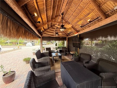 Enjoy sweeping panoramic views from this exceptional 3,031 sq ft on St. Lucie Trail Golf Club in Florida - for sale on GolfHomes.com, golf home, golf lot