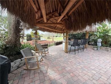 Enjoy sweeping panoramic views from this exceptional 3,031 sq ft on St. Lucie Trail Golf Club in Florida - for sale on GolfHomes.com, golf home, golf lot