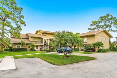 Immaculate first floor end-unit townhome showcasing tranquil on Riverbend Golf Club in Florida - for sale on GolfHomes.com, golf home, golf lot