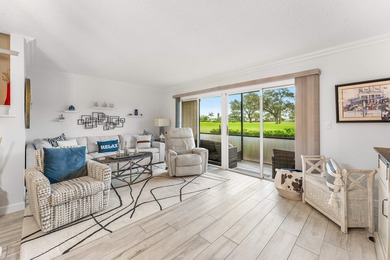 Immaculate first floor end-unit townhome showcasing tranquil on Riverbend Golf Club in Florida - for sale on GolfHomes.com, golf home, golf lot