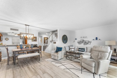 Immaculate first floor end-unit townhome showcasing tranquil on Riverbend Golf Club in Florida - for sale on GolfHomes.com, golf home, golf lot