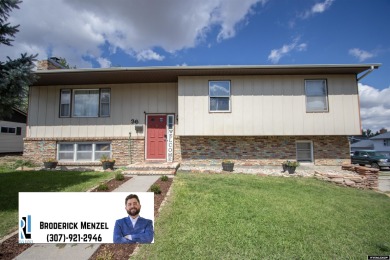 Don't Miss this corner lot beauty! Walking distance from on Paradise Valley Country Club in Wyoming - for sale on GolfHomes.com, golf home, golf lot